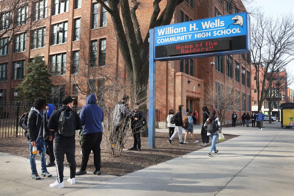 Students leave William H. Wells Community High School at the end of the school day in Chicago. The federal Centers for Disease Control and Prevention’s latest national survey of high school students focuses on diet, physical activity, sleep, digital behavior and mental health. (Photo by Scott Olson/Getty Images)