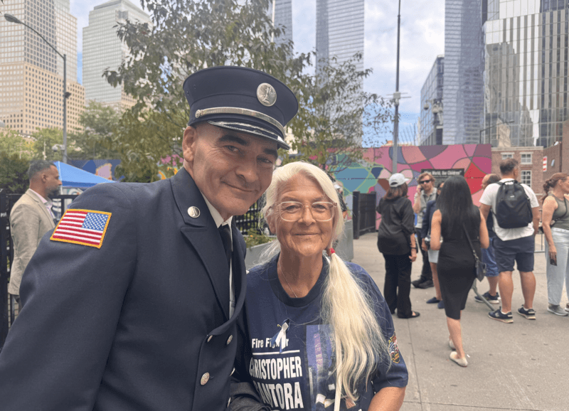 Jason Roettger, 56, and his mother, Karen Roettger, 83, attended the 25th anniversary of 9/11 in New York City on Sept. 11, 2026. He lost his cousin in the attacks on the World Trade Center and said he was honored to be chosen to read names of people who had died on that tragic day. (Photo by Shalina Chatlani/ Stateline).