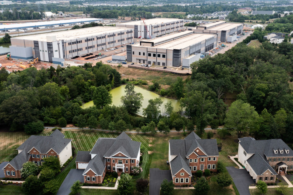 An aerial view shows a data center situated near single-family homes in Northern Virginia. The backlash against data centers has become a flashpoint in state and federal races across the country. (Photo by Nathan Howard/Getty Images)