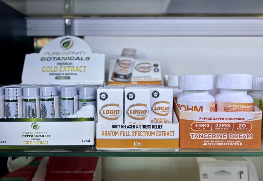 Liquid kratom extracts and capsules containing 7-OH are displayed for sale at a smoke shop in Buffalo, N.Y. A growing market is prompting state lawmakers to reconsider how the substance should be regulated. (Photo by Amanda Watford/Stateline)