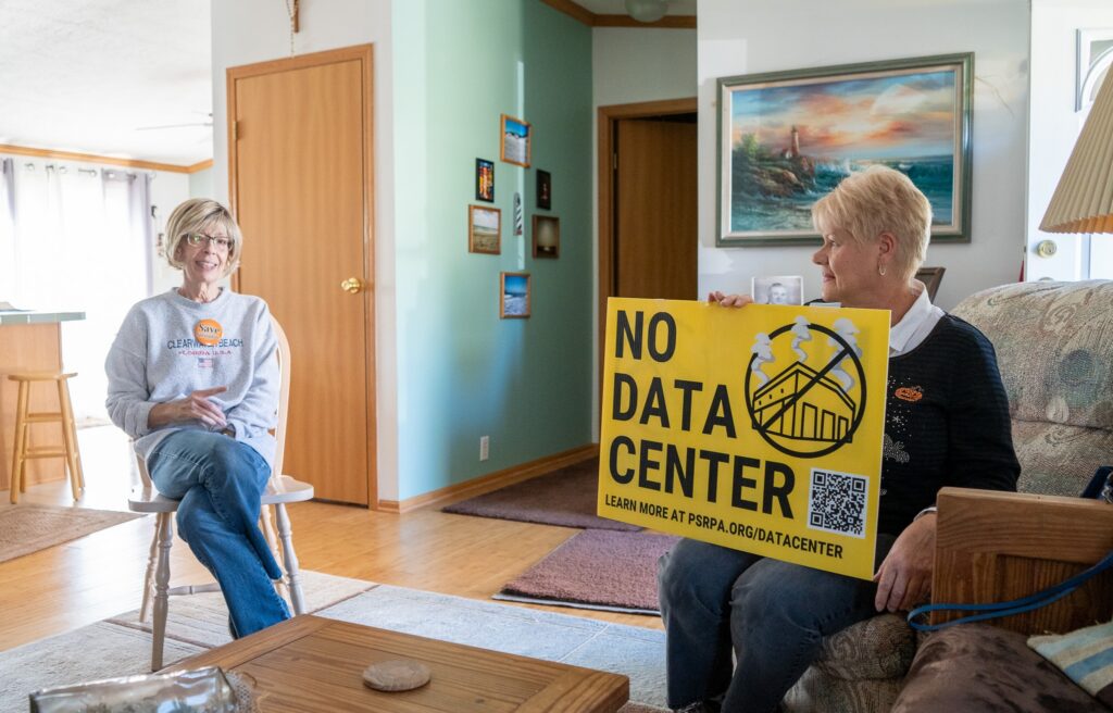Vicki Wanamaker, left, and Cathy Mager, right, talked in Wanamaker's Springdale, Pennsylvania, home on Oct. 19, 2026, about their opposition to a proposed hyperscale data center roughly a quarter mile away. (Photo by Ashley Murray/States Newsroom)