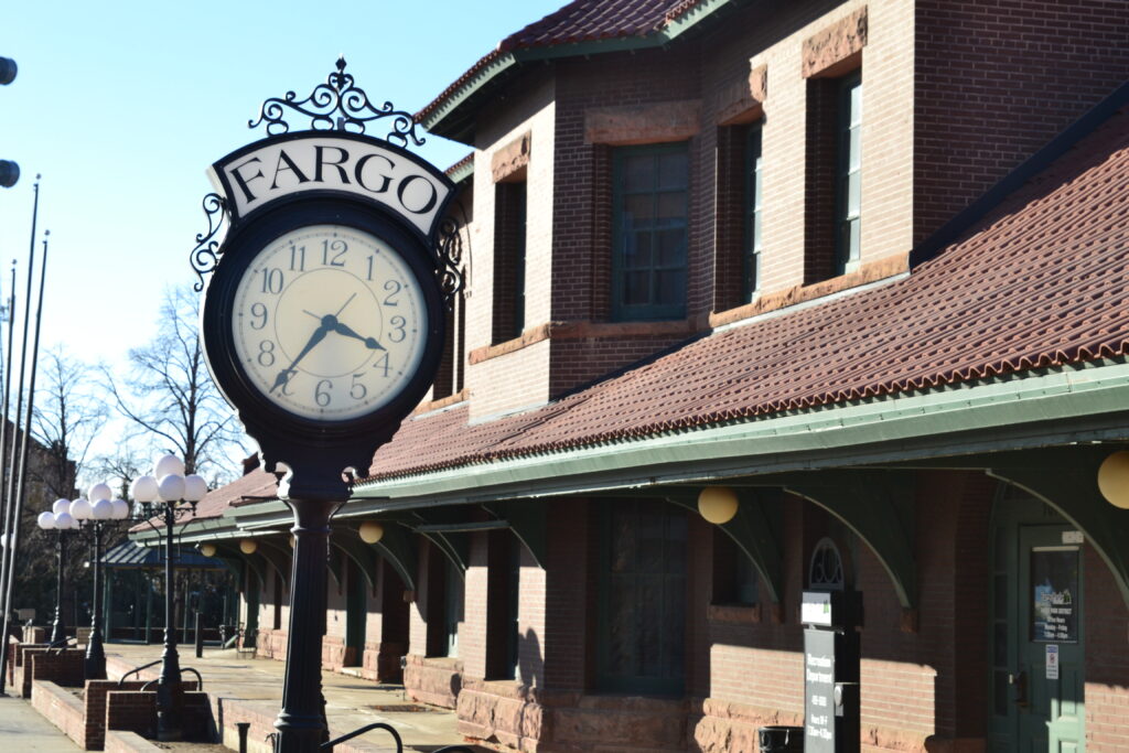 A clock stands in front of the former train depot in downtown Fargo, North Dakota, on March 6, 2025. (Photo by Jeff Beach/North Dakota Monitor)